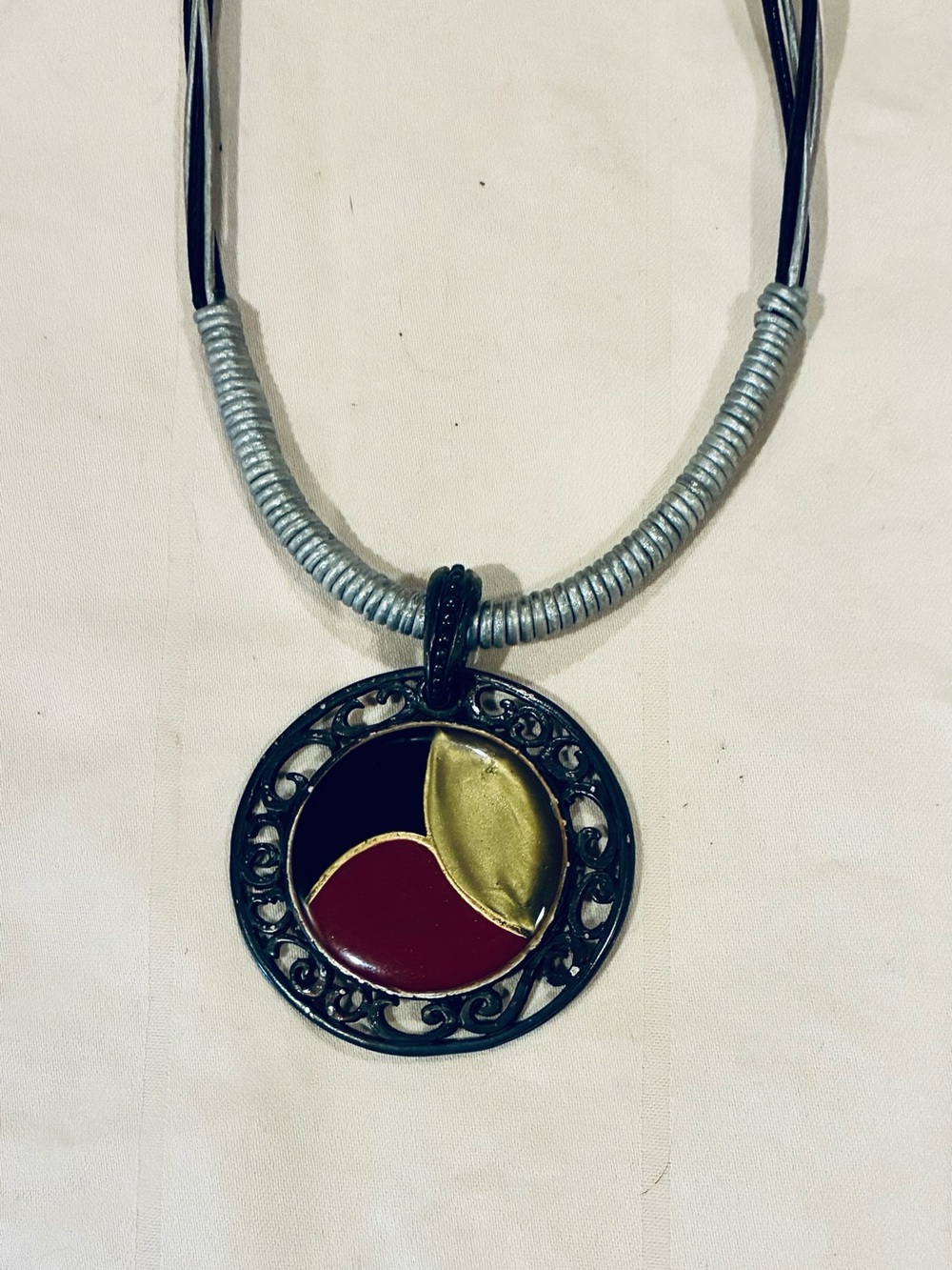 Black, Red & Gold Round Pendant Necklace on Silver Leather and Wrapped Coils